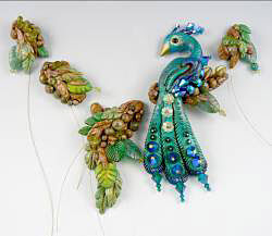 Clay peacock and branches